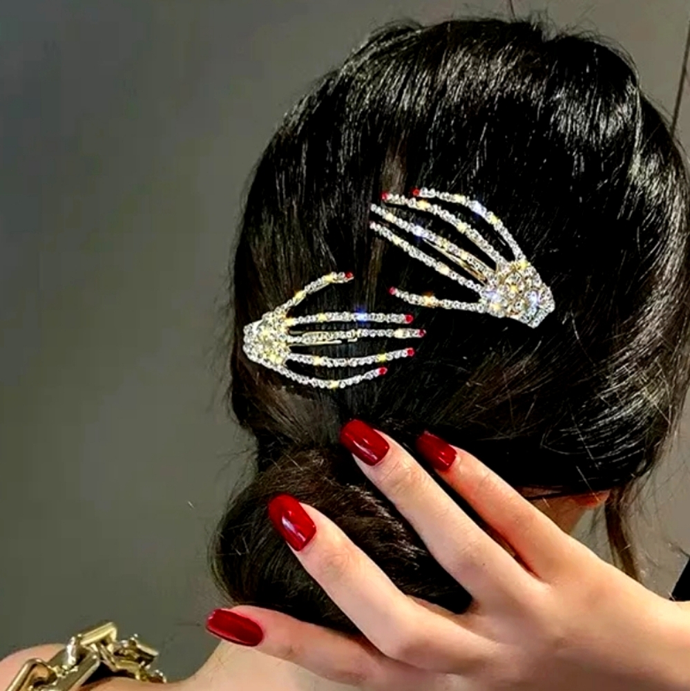 Red fingertips hand hair clip